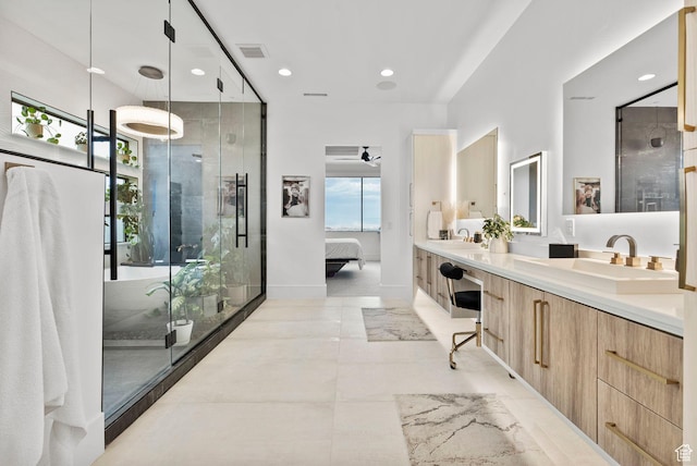 bathroom featuring vanity, ceiling fan, and an enclosed shower