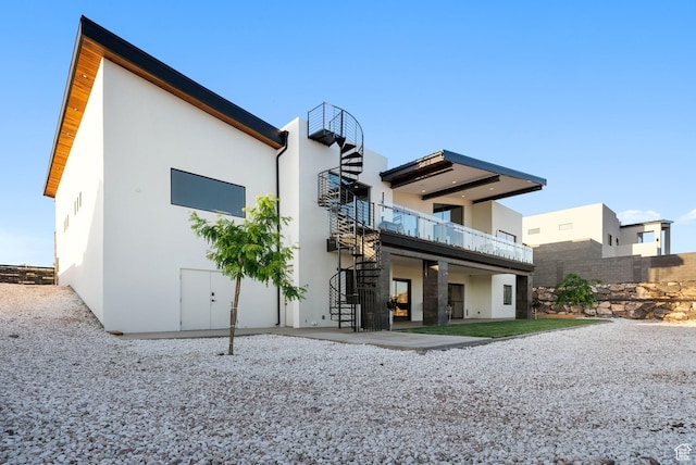 back of property featuring a patio