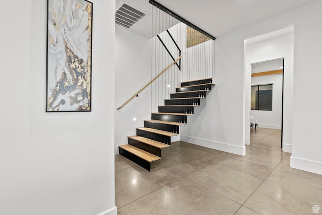 stairway with concrete floors
