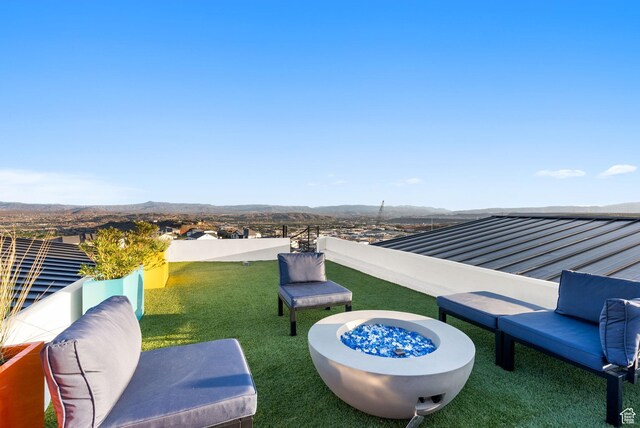 view of patio / terrace featuring an outdoor fire pit