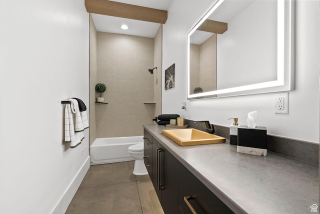 full bathroom featuring tile patterned floors, vanity, toilet, and tiled shower / bath combo