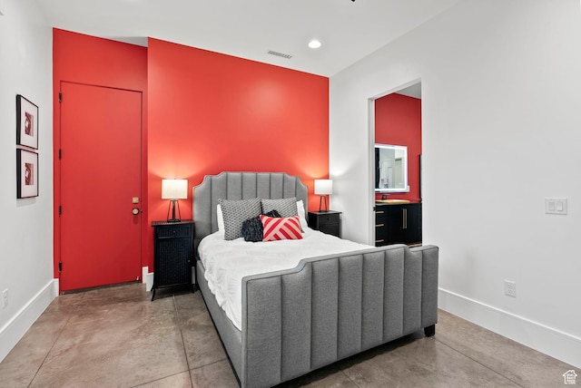 bedroom featuring concrete floors