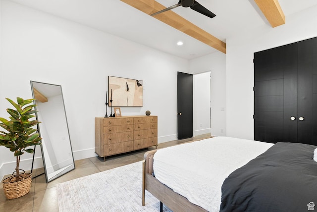 bedroom featuring beam ceiling, light tile patterned floors, and ceiling fan