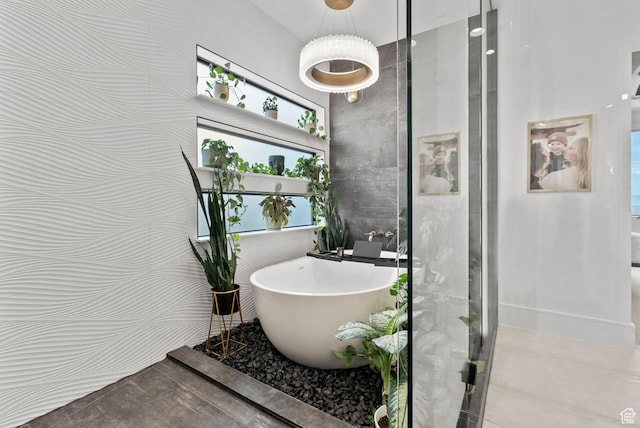 bathroom with tile walls and plus walk in shower