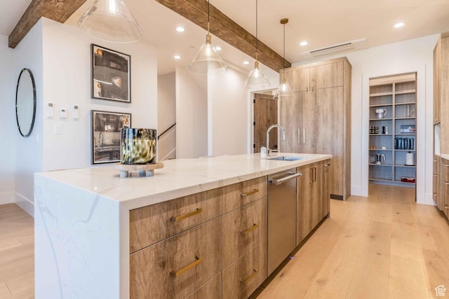 1269 Rothwell Rd, Park City, UT 84060 - kitchen with a large island, beamed ceiling, stainless steel dishwasher, pendant lighting, and light hardwood / wood-style floors
