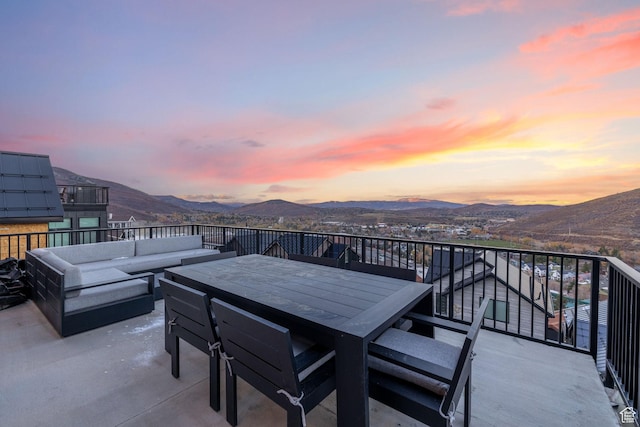 1269 Rothwell Rd, Park City, UT 84060 - patio terrace at dusk featuring a mountain view, a balcony, and an outdoor living space