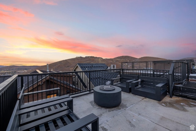 1269 Rothwell Rd, Park City, UT 84060 - patio terrace at dusk featuring a mountain view and an outdoor living space with a fire pit