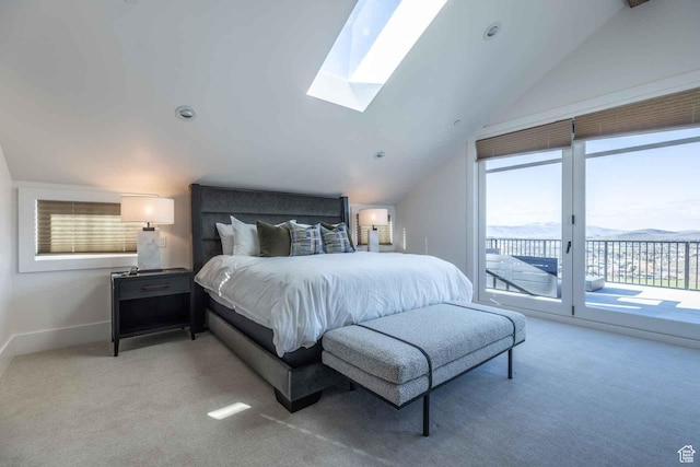 1269 Rothwell Rd, Park City, UT 84060 - carpeted bedroom featuring access to outside, a mountain view, and vaulted ceiling with skylight