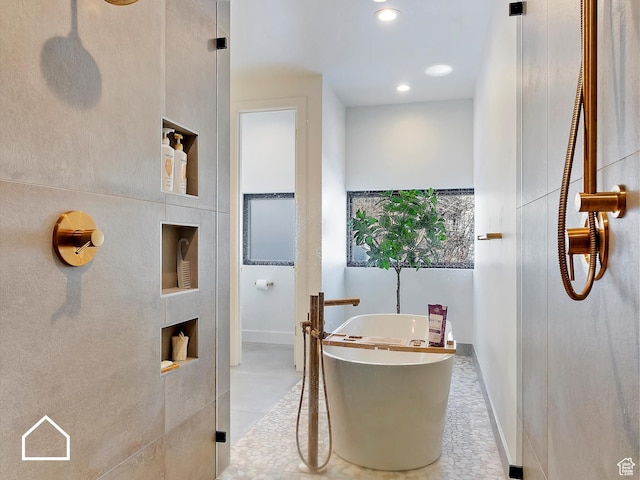 bathroom featuring a washtub