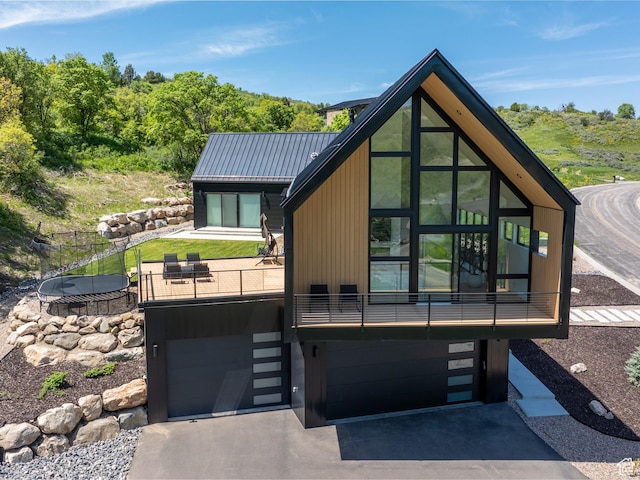 1113 S Quail Holw E, Huntsville, UT 84317 - back of house with asphalt driveway and an attached garage