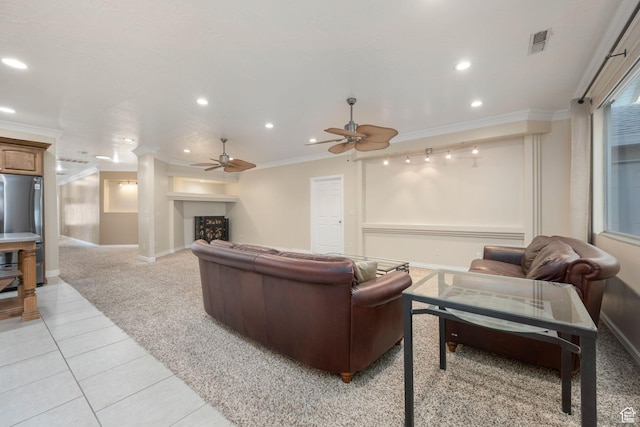living area featuring ceiling fan, recessed lighting, ornamental molding, and light tile patterned floors