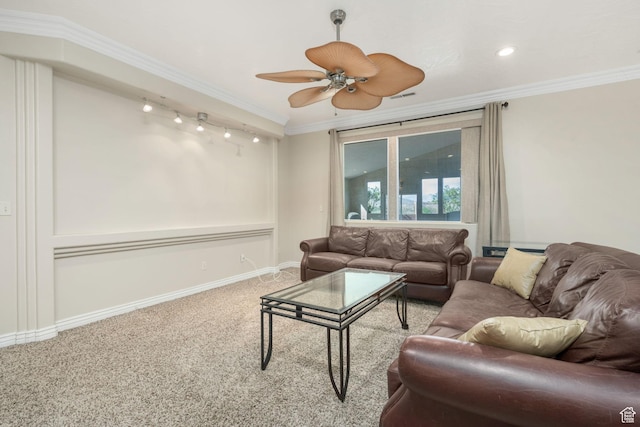 living room featuring baseboards, ceiling fan, carpet, and ornamental molding