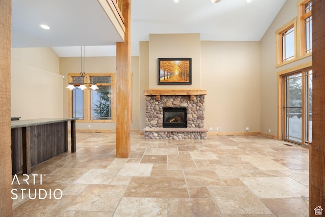 7352 Pine Dr, Park City, UT 84098 - unfurnished living room featuring a fireplace and an inviting chandelier