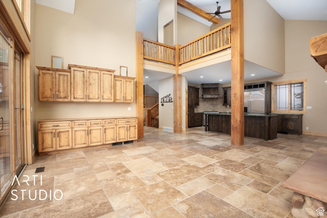 7352 Pine Dr, Park City, UT 84098 - kitchen with stainless steel built in fridge, a towering ceiling, and custom range hood