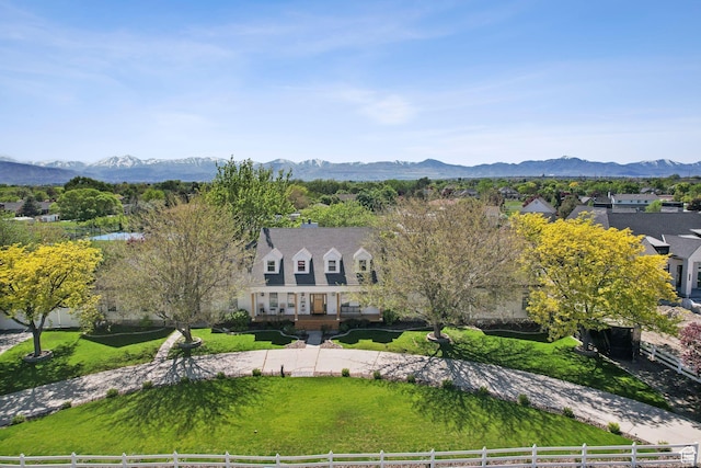 birds eye view of property with a mountain view