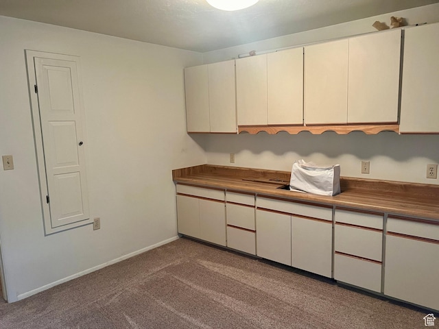 1581 E 6470 S, Murray, UT 84121 - kitchen with carpet floors, dark countertops, and baseboards