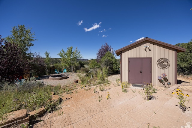 view of outdoor structure with a fire pit