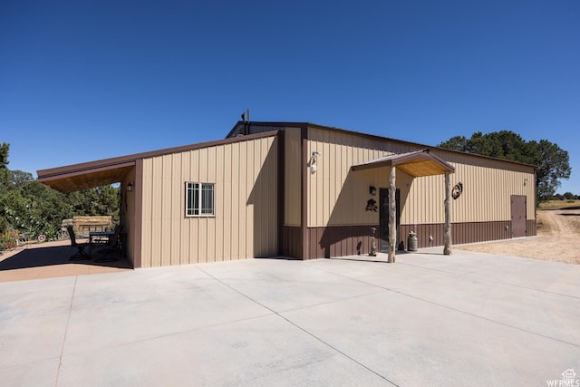 exterior space with a carport