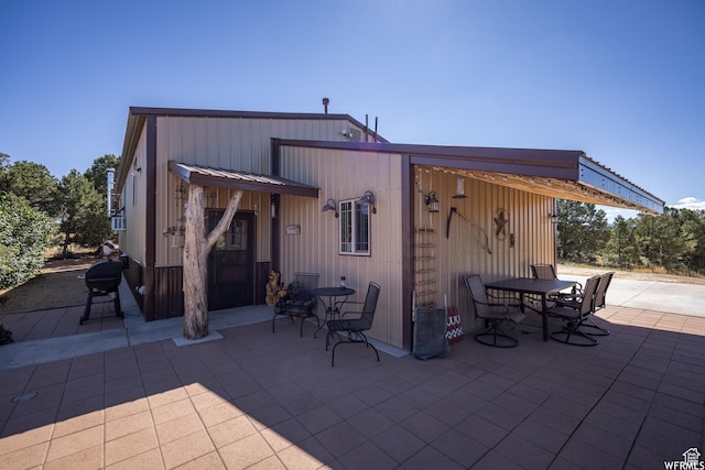 rear view of property featuring a patio area