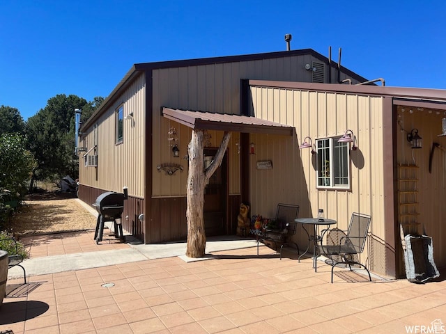 back of property featuring a patio