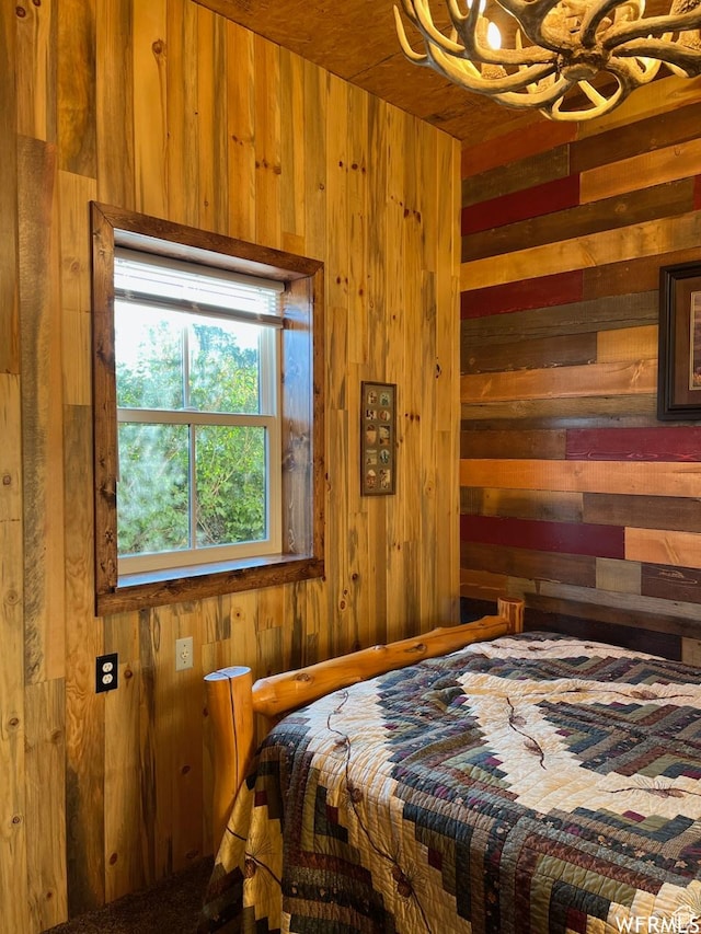 bedroom with wooden walls