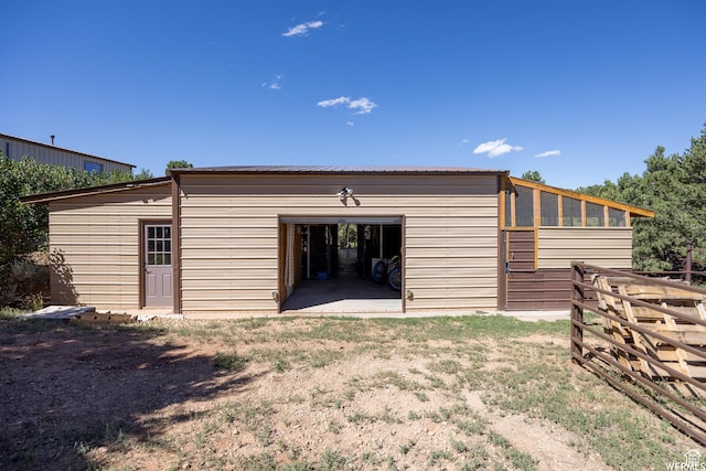 back of property with an outbuilding