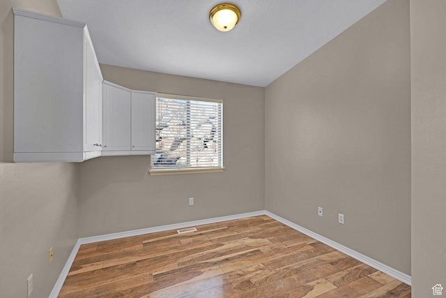 unfurnished room featuring light wood-type flooring