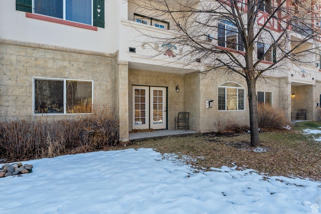 view of snow covered property entrance