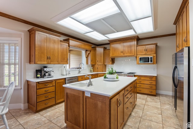 650 E 600 S, Spring City, UT 84662 - kitchen with appliances with stainless steel finishes, brown cabinets, backsplash, an island with sink, and light countertops