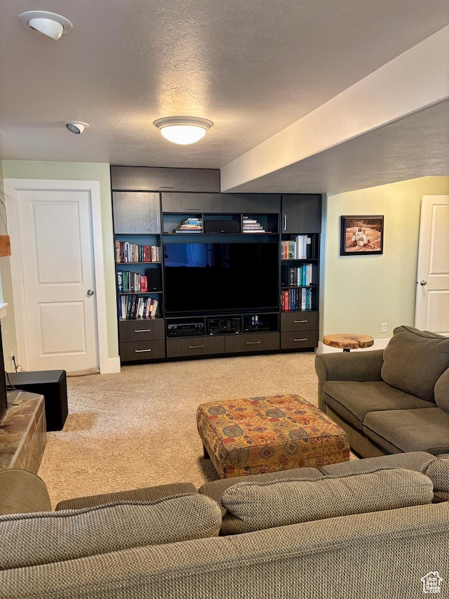 living area with light carpet and a textured ceiling