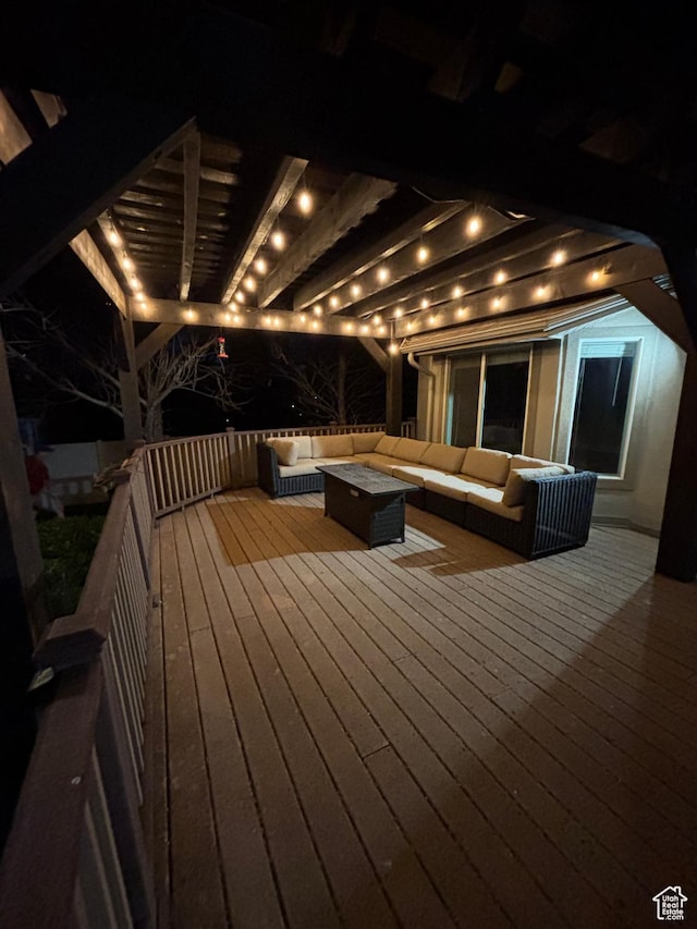 deck at twilight featuring an outdoor living space