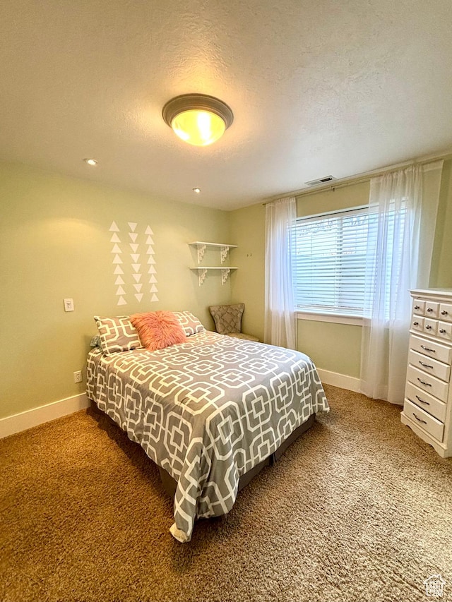 bedroom featuring baseboards, carpet floors, a textured ceiling, and recessed lighting