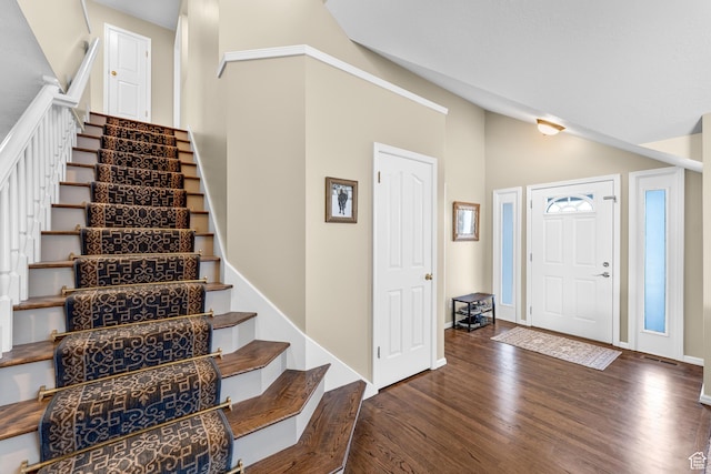 3893 S Bountiful Blvd, Bountiful, UT 84010 - entrance foyer featuring stairway, baseboards, vaulted ceiling, and wood finished floors