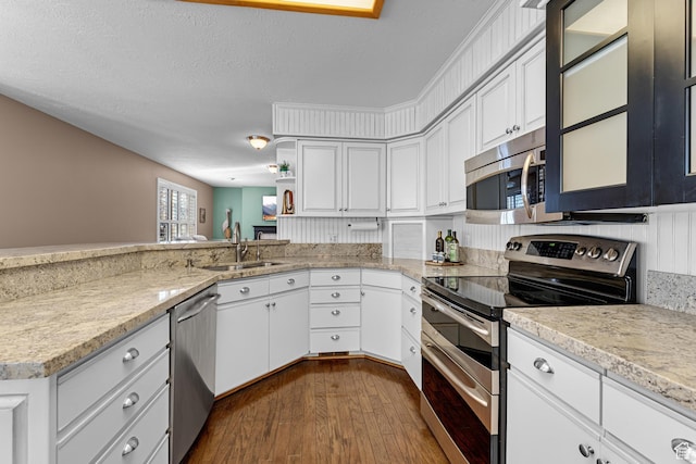 3893 S Bountiful Blvd, Bountiful, UT 84010 - kitchen featuring white cabinets, open shelves, a sink, dark wood finished floors, and stainless steel appliances
