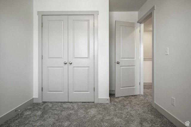 639 S 85 E Unit 28, Smithfield, UT 84335 - unfurnished bedroom featuring carpet flooring, baseboards, and a closet