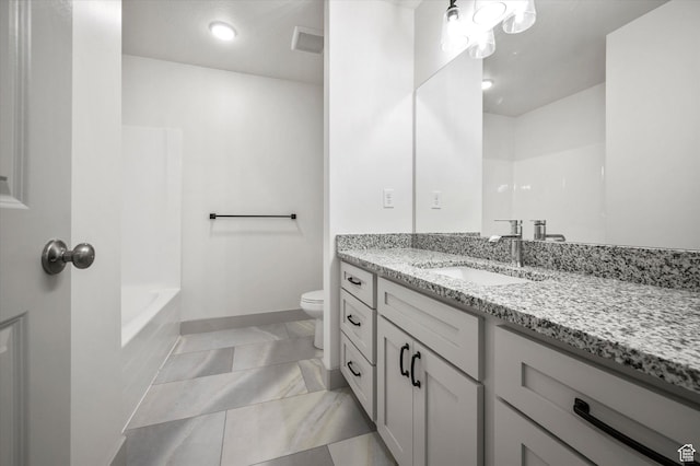 639 S 85 E Unit 28, Smithfield, UT 84335 - full bath with visible vents, toilet, marble finish floor, baseboards, and vanity
