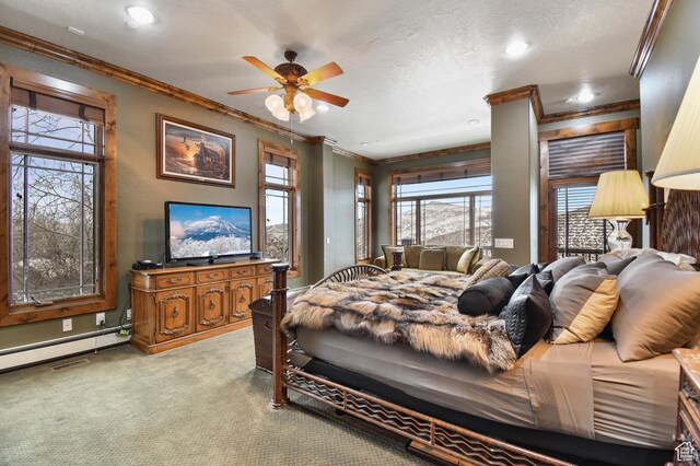 carpeted bedroom featuring a textured ceiling, ceiling fan, crown molding, and a baseboard radiator