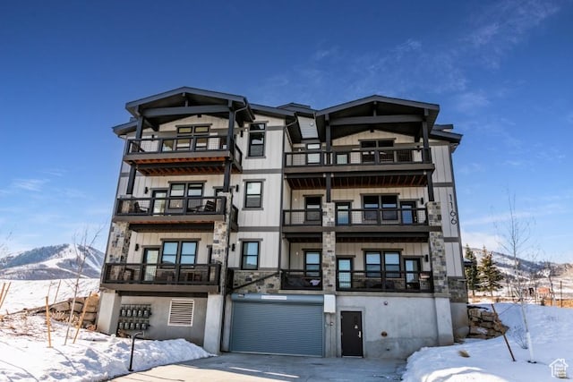 1166 W Helling Cir Unit 203, Heber City, UT 84032 - snow covered property with a mountain view and a garage