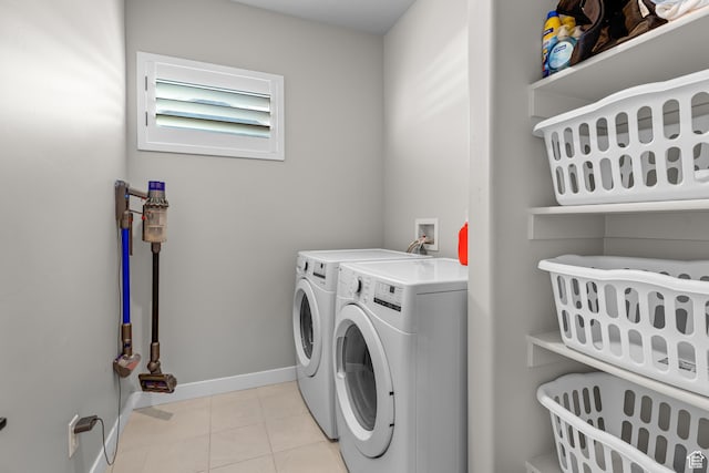 2217 E Emerald Ave, Eagle Mountain, UT 84005 - laundry room featuring washer and dryer, baseboards, and light tile patterned flooring