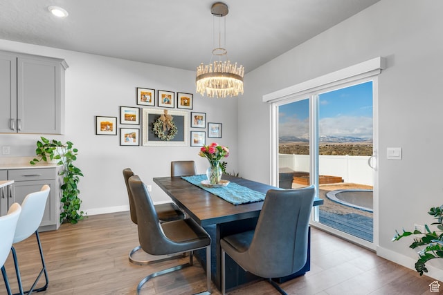 2217 E Emerald Ave, Eagle Mountain, UT 84005 - dining room featuring a chandelier, baseboards, light wood-style floors, and recessed lighting