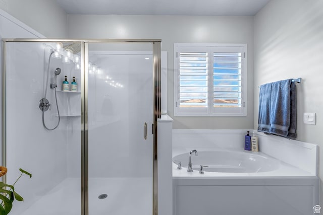 2217 E Emerald Ave, Eagle Mountain, UT 84005 - bathroom featuring a shower stall and a bath