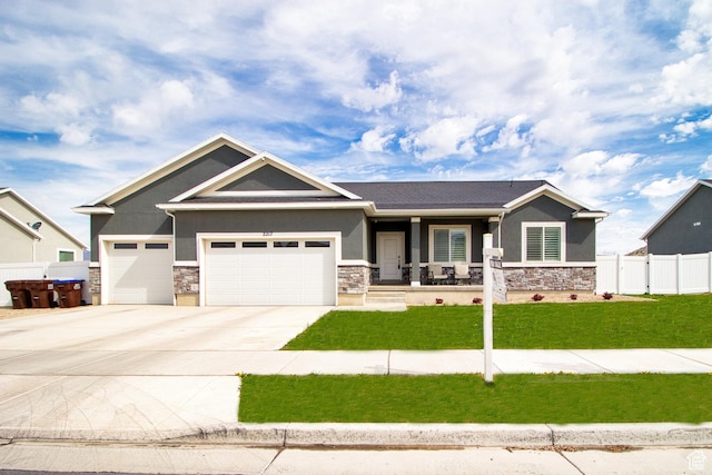 craftsman-style house featuring stucco siding and stone siding