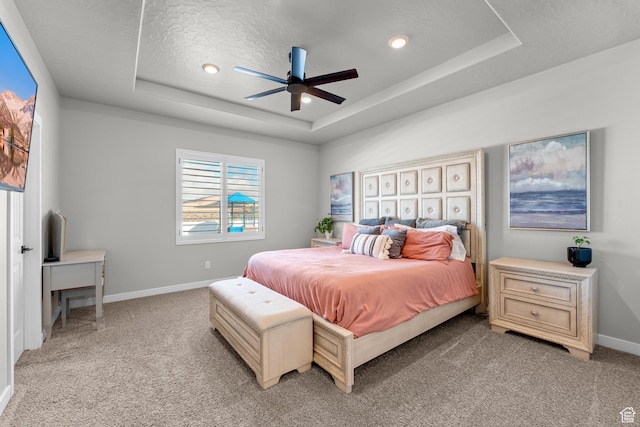 2217 E Emerald Ave, Eagle Mountain, UT 84005 - bedroom with a tray ceiling, light colored carpet, baseboards, a ceiling fan, and recessed lighting