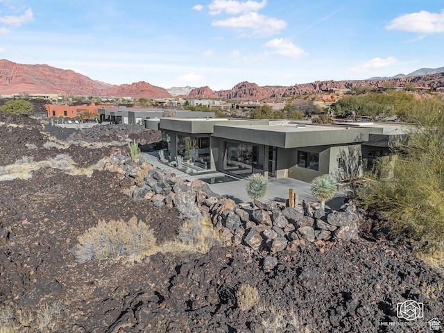 2523 N Chaco Trl, St George, UT 84770 - rear view of property featuring a mountain view, stucco siding, and a patio