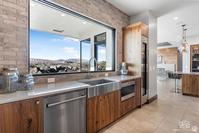 2523 N Chaco Trl, St George, UT 84770 - kitchen featuring dishwasher, a sink, light countertops, light tile patterned flooring, and recessed lighting