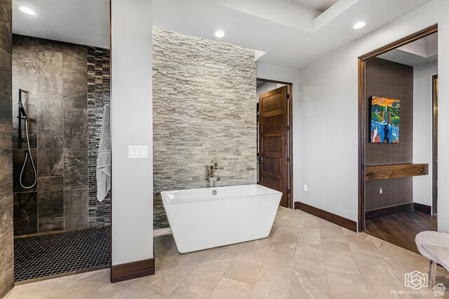 2523 N Chaco Trl, St George, UT 84770 - bathroom with recessed lighting, a freestanding bath, walk in shower, baseboards, and marble finish flooring