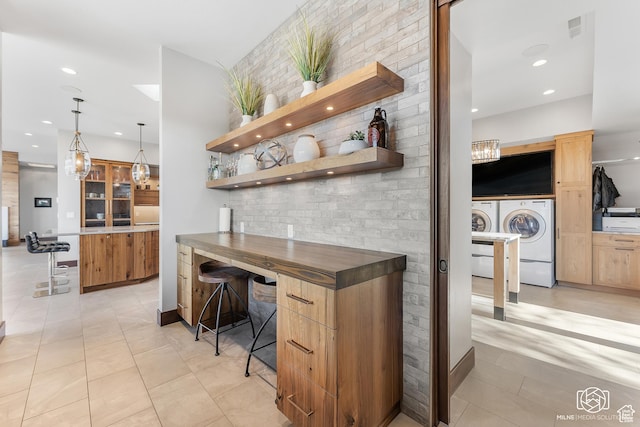 2523 N Chaco Trl, St George, UT 84770 - bar with separate washer and dryer, recessed lighting, light tile patterned floors, and pendant lighting
