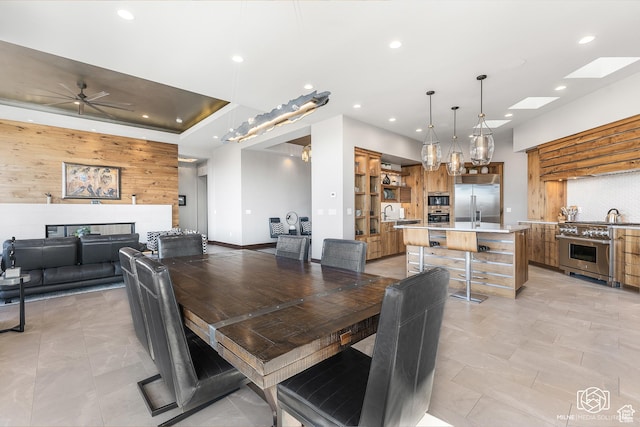 2523 N Chaco Trl, St George, UT 84770 - dining space with wooden walls, recessed lighting, ceiling fan, and a skylight