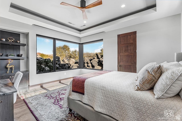 2523 N Chaco Trl, St George, UT 84770 - bedroom with a raised ceiling, recessed lighting, wood finished floors, and ceiling fan