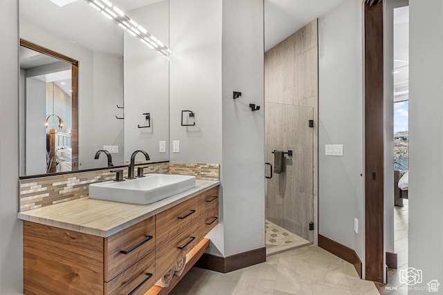 2523 N Chaco Trl, St George, UT 84770 - bathroom with vanity, a shower stall, baseboards, backsplash, and marble finish floors